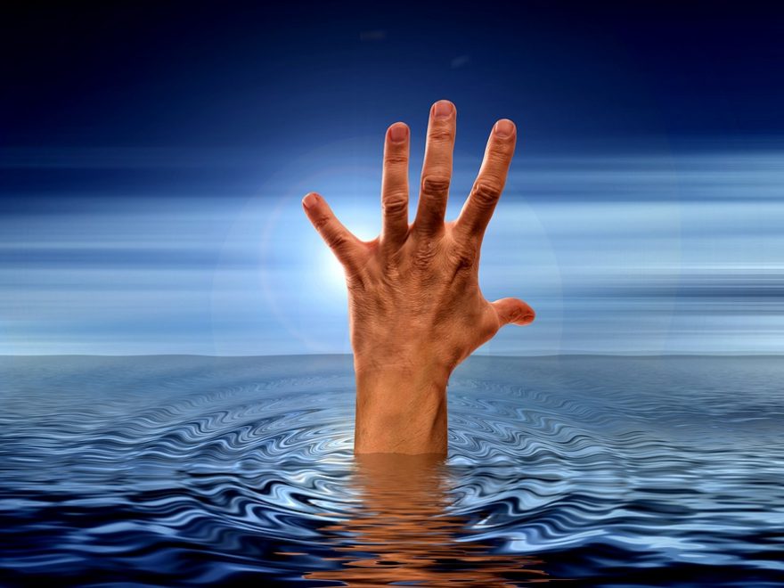 hand reaching out from under water